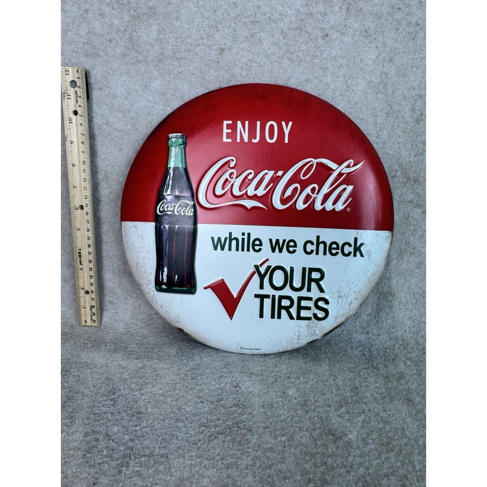 Enjoy Coca-Cola While We Check Your Tires Embossed Metal Button Sign